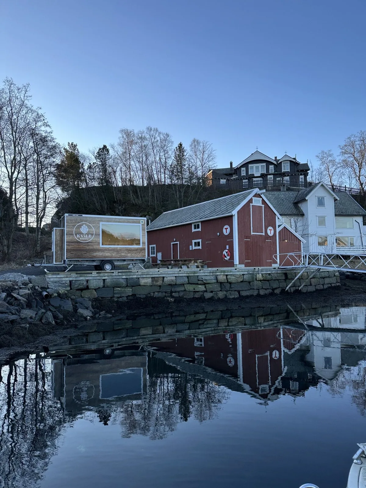 Haugesund's Smedasundet canal lined with colourful buildings and boats on a clear day