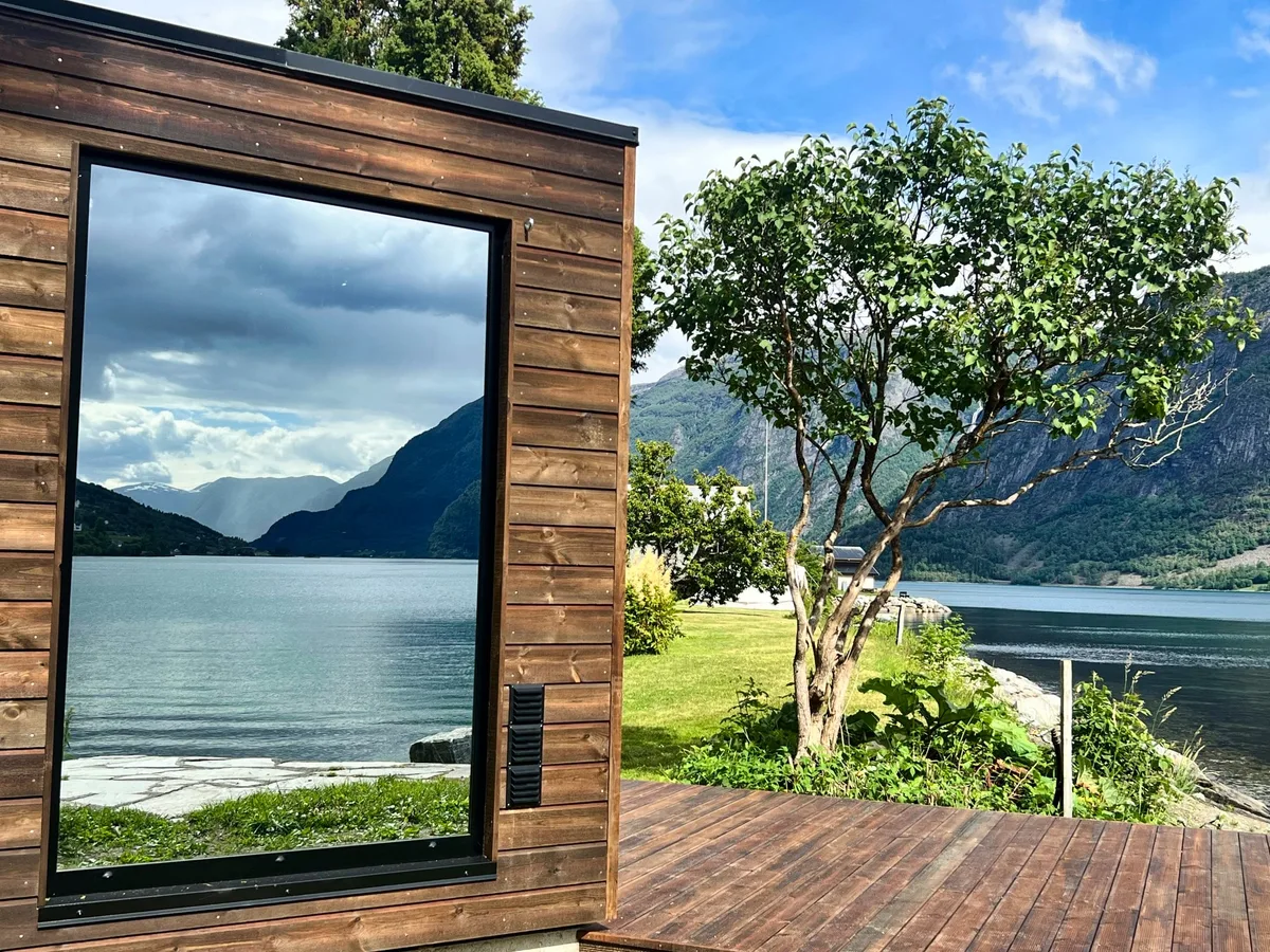 The Sognefjord seen from above with deep blue water and snow-capped mountains on both sides